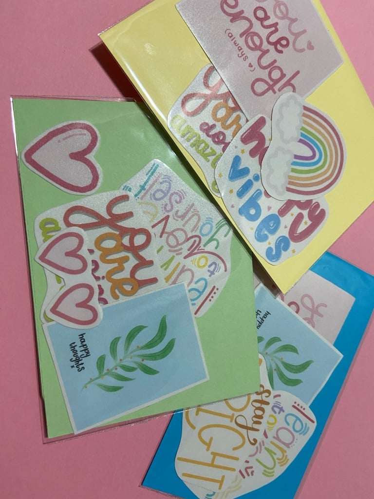 3 positivity packs filled with various colourful stickers